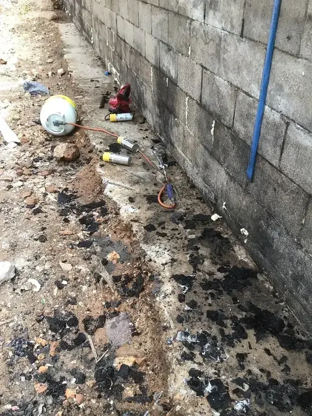 Foundation crew running laser levels on a new residential foundation job site